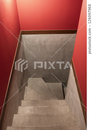 Concrete staircase with red painted walls Concrete staircase with red painted walls 126097968