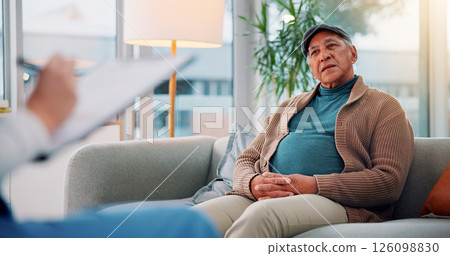 Writing, clipboard and talking with nurse and old man on sofa for counseling, dementia rehabilitation or therapy. Memory support, healthcare and psychiatrist with senior person in office for advice 126098830