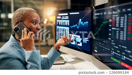 Phone call, computer screen and black woman in office at night for investment negotiation, finance or profit. Cellphone, contact and trader with discussion for financial statistics, graphs or charts. Phone call, computer screen and black woman in office at night for investment negotiation, finance or profit. Cellphone, contact and trader with discussion for financial statistics, graphs or charts. 126099184