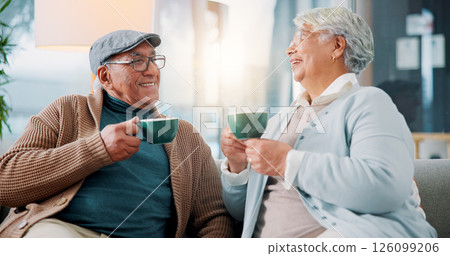 Happy old couple, talking and drinking coffee in home for relax, story and enjoy latte together. Senior man, woman and tea cup in living room for retirement, laughing and morning chat with funny joke 126099206
