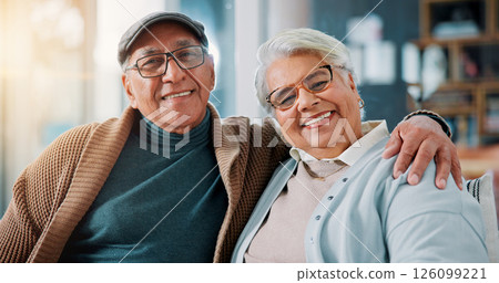 Senior couple, portrait and love in home with smile, bonding and healthy relationship in retirement. Elderly man, mature wife and hug in living room with commitment, relax and support in marriage Senior couple, portrait and love in home with smile, bonding and healthy relationship in retirement. Elderly man, mature wife and hug in living room with commitment, relax and support in marriage 126099221