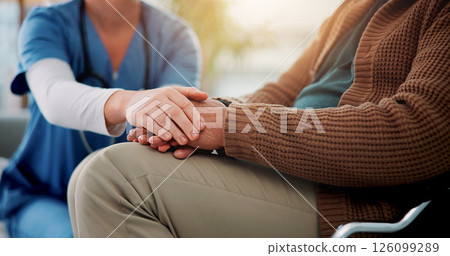 Couch, nurse and senior patient with holding hands for support, empathy and console for medical news. Home, caregiver and old person with consultation for wellness, compassion and trust in closeup 126099289