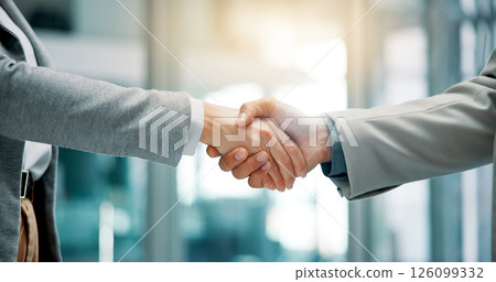 Handshake, deal and business people in office with partnership, contract or merger. Collaboration, thank you and finance manager shaking hands with investor for investment opportunity or negotiation. 126099332