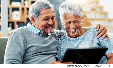 Home, relax and senior couple with tablet, watching and streaming of movies in living room or online. House, old man and woman with tech for entertainment, hug and smile for film on website in lounge 126099681