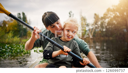 Lake, woman and kid with learning for kayak, water activity and adventure in summer camp. River, child and female instructor with teaching for canoeing, skills development and paddle outdoor in boat 126099737