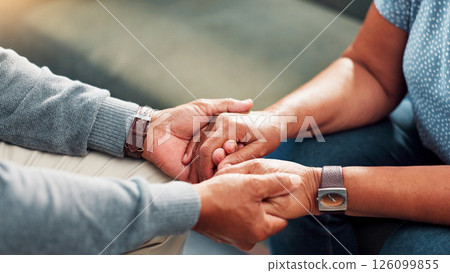 Comfort, empathy and holding hands with senior couple in home living room together for love or support. Compassion, sympathy and trust with old people closeup in apartment for connection or healing 126099855