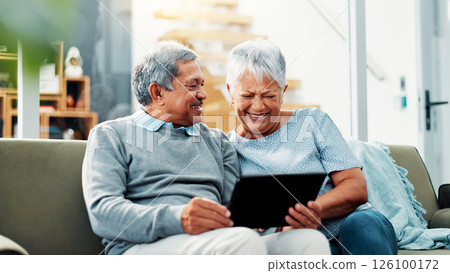 Home, laughing and senior couple with tablet, watching and streaming of movies, online and living room. Retirement, old man and woman with tech for entertainment, bonding and smile for comedy film 126100172