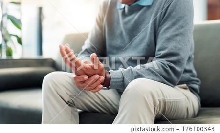 Hand, pain and old person on couch with injury, retirement and health issue with carpal tunnel syndrome at home. Fibromyalgia, arthritis or brittle bones with ache, inflammation and pressure in house Hand, pain and old person on couch with injury, retirement and health issue with carpal tunnel syndrome at home. Fibromyalgia, arthritis or brittle bones with ache, inflammation and pressure in house 126100343