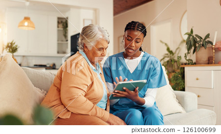 Tablet, consultation and mature woman with caregiver for medical discussion on sofa in home. Technology, conversation and nurse explain with elderly patient, diagnosis and assisted living at house 126100699