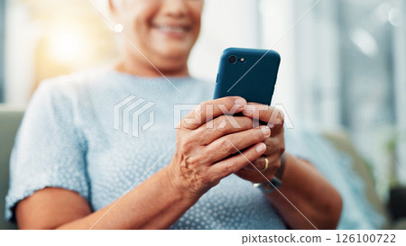 Senior woman, hands and typing with phone for game, word search or online entertainment on sofa at home. Closeup, elderly or female person with smile on mobile smartphone for chatting or texting app Senior woman, hands and typing with phone for game, word search or online entertainment on sofa at home. Closeup, elderly or female person with smile on mobile smartphone for chatting or texting app 126100722