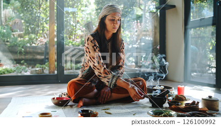 Incense, alternative medicine and woman on floor for spiritual meditation, holistic treatment and healing. Aromatherapy, cleanse and person with stones for balance, chakra and detox for wellness 126100992