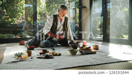 Floor, alternative medicine and Asian man for holistic treatment, spiritual meditation and healing. Aromatherapy, incense and healer with crystal stones for peace, chakra and detox for wellness Floor, alternative medicine and Asian man for holistic treatment, spiritual meditation and healing. Aromatherapy, incense and healer with crystal stones for peace, chakra and detox for wellness 126101044