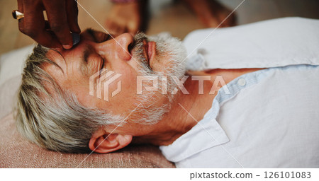 Crystal, meditation and peace with man on floor for energy balance, healing ritual or spirituality. Third eye chakra, zen or holistic with senior person for aura cleanse, calm and wellness ceremony 126101083