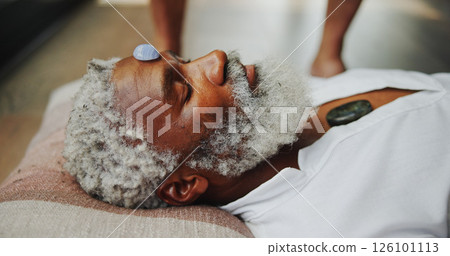 Crystal, zen and healing with man on floor for energy balance, meditation ritual or spirituality. Third eye chakra, peace or holistic with senior person for aura cleanse, shaman and wellness ceremony 126101113