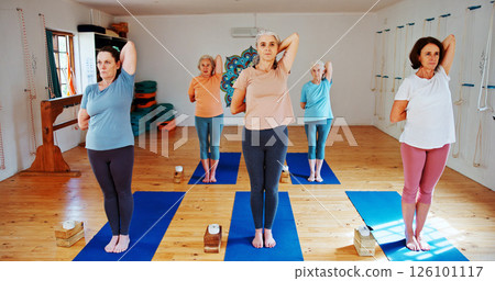 Yoga class, old women and stretching with energy, spiritual wellness and pilates with fitness. Elderly people, pensioner and group in health club, retirement and balance with exercise and workout 126101117