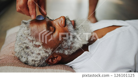 Crystal, meditation and healing with man on floor for energy balance, zen ritual or spirituality. Third eye chakra, peace or holistic with senior person for aura cleanse, shaman and wellness ceremony Crystal, meditation and healing with man on floor for energy balance, zen ritual or spirituality. Third eye chakra, peace or holistic with senior person for aura cleanse, shaman and wellness ceremony 126101125