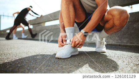 Fitness, hands and tie shoes on street to start workout, training and exercise for practice on road. City, man and runner tying laces on sneakers for sports, preparation and ready for challenge Fitness, hands and tie shoes on street to start workout, training and exercise for practice on road. City, man and runner tying laces on sneakers for sports, preparation and ready for challenge 126101129