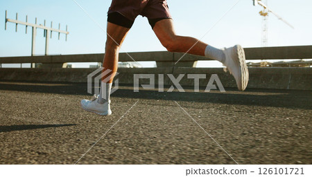 Health, fitness and legs of person running on bridge in city for race, marathon or training. Sports, outdoor and feet of athlete on highway with cardio workout, challenge or exercise in town. 126101721