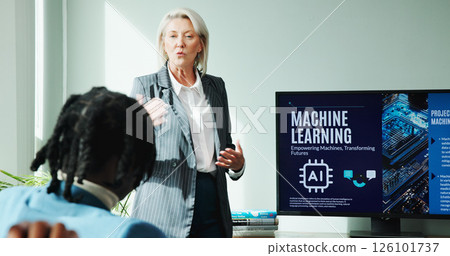 Business woman, conference room and presentation on screen for innovation, idea and ai training. Mature speaker, office and pitch proposal to team for machine learning project, coaching or workshop Business woman, conference room and presentation on screen for innovation, idea and ai training. Mature speaker, office and pitch proposal to team for machine learning project, coaching or workshop 126101737