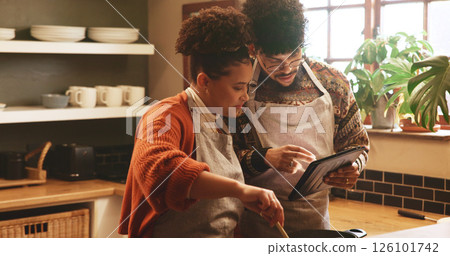 Couple, tablet and cooking in kitchen with pot for recipe, video or guide for meal prep in home. People, man and woman with digital touchscreen, app or partner for food, nutrition or diet in house 126101742