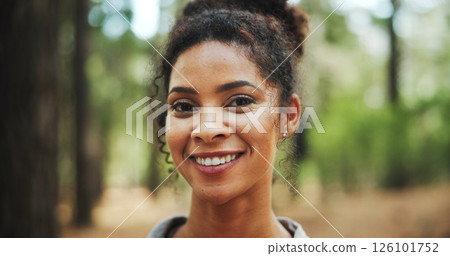 Woman, portrait and happy with hiking in forest for travel adventure, weekend break and sightseeing nature. Smile, person and trekking in woods for holiday exploration, outdoor journey and confidence 126101752