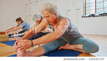 Elderly woman, stretching and feet in yoga class, flexibility and spiritual wellness. Senior person, muscle warm up and community for pilates, holistic practice and mobility exercise at health club Elderly woman, stretching and feet in yoga class, flexibility and spiritual wellness. Senior person, muscle warm up and community for pilates, holistic practice and mobility exercise at health club 126102147