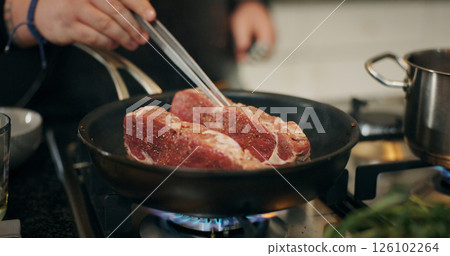 Cooking, stove and chef with meat in pan in kitchen for culinary skill, recipe and meal prep for dinner. Food, sear and person with beef, steak and protein for gourmet dish, ingredients and cuisine Cooking, stove and chef with meat in pan in kitchen for culinary skill, recipe and meal prep for dinner. Food, sear and person with beef, steak and protein for gourmet dish, ingredients and cuisine 126102264