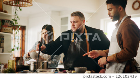 Cooking, chef and couple with lesson in kitchen for meal preparation, culinary skills and recipe instructions. Professional guide, people and learning food tutorial with dinner tips and demonstration 126102439