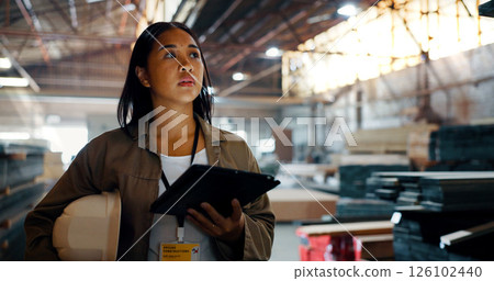 Construction, woman and engineer thinking with tablet for woodwork, insight and vision for renovation. Technology, planning and carpenter working in warehouse to check stock for building development 126102440
