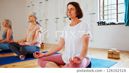 Floor, lotus and women with meditation class for calm mindset, zen or peace in mental wellness. Posture, morning and mature people in group yoga together for mindfulness, relax or holistic self care Floor, lotus and women with meditation class for calm mindset, zen or peace in mental wellness. Posture, morning and mature people in group yoga together for mindfulness, relax or holistic self care 126102528