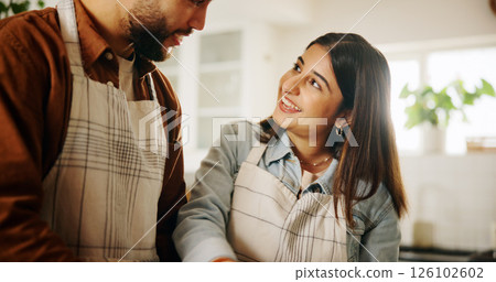 Happy, cooking and couple in kitchen in home together for bonding, talking and connection. Conversation, helping and man with woman for preparing meal, food or dinner for health diet in apartment. 126102602