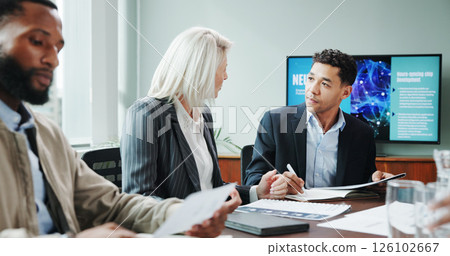 Corporate, people and meeting with document in office for planning, neuroscience and innovation idea. Manager, presentation and briefing with paperwork, brain technology and proposal of neurofeedback Corporate, people and meeting with document in office for planning, neuroscience and innovation idea. Manager, presentation and briefing with paperwork, brain technology and proposal of neurofeedback 126102667