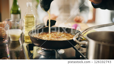 Cooking, pan and recipe with person in kitchen of restaurant closeup with sauce, health or nutrition. Food, gas stove and ingredients with chef in hotel for gourmet cuisine, hospitality or service 126102743