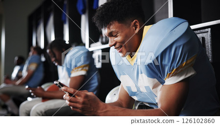 Football, phone and happy with man in locker room for rookie drafting, pro league research and contact. Game score update, team roster with person for connection, training schedule and player stats Football, phone and happy with man in locker room for rookie drafting, pro league research and contact. Game score update, team roster with person for connection, training schedule and player stats 126102860