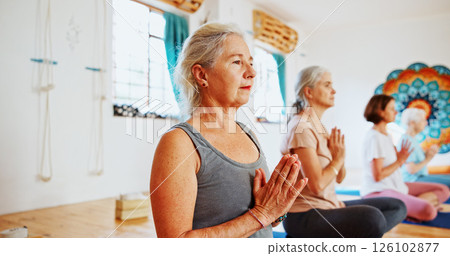 Hands, namaste and mature women with meditation for calm mindset, zen or peace in mental wellness. Posture, morning and people in class together for mindfulness, relax or holistic self care in yoga 126102877