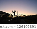 Silhouette of a bronze statue at Chiba Port Park during magic hour 126102891
