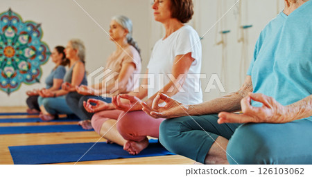 Hands, lotus and women with meditation class for calm mindset, zen or peace in mental wellness. Posture, morning and people in group together for mindfulness, relax or holistic self care on yoga mat Hands, lotus and women with meditation class for calm mindset, zen or peace in mental wellness. Posture, morning and people in group together for mindfulness, relax or holistic self care on yoga mat 126103062