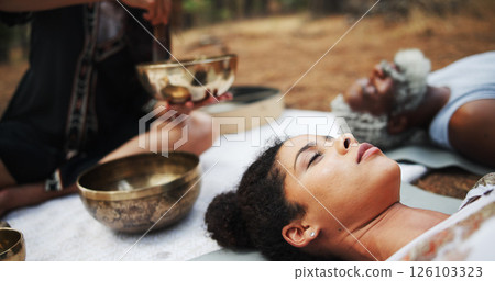 Meditation, sound therapy and people with bowls on floor for mindfulness, spiritual cleanse and energy. Nature, ritual and healer with men and women with frequency for healing, balance and wellness Meditation, sound therapy and people with bowls on floor for mindfulness, spiritual cleanse and energy. Nature, ritual and healer with men and women with frequency for healing, balance and wellness 126103323