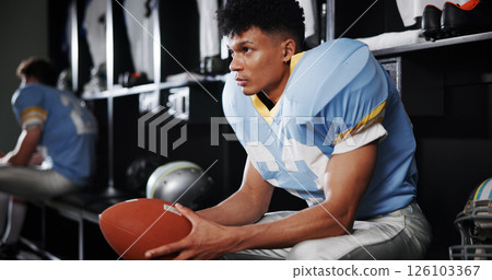Thinking, man and football player in locker room for preparation, sports match and game plan. Male athlete, waiting and half time for competition strategy, fitness challenge and choice for tournament 126103367