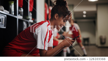 Fitness, watching and woman with smartphone, smile and browsing of video on social media and online. Happy, football player and person with mobile for streaming, healthy and girl with sportswear Fitness, watching and woman with smartphone, smile and browsing of video on social media and online. Happy, football player and person with mobile for streaming, healthy and girl with sportswear 126103388