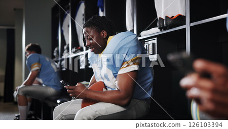 Football, phone and smile with man in locker room for rookie drafting, pro league research and contact. Game score update, team roster with person for connection, training schedule and player stats 126103394