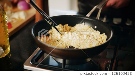 Cooking, pan and rice with person in kitchen of restaurant closeup for diet, health or nutrition. Gas stove, ingredients and risotto with chef in hotel for gourmet cuisine, hospitality or service 126103438