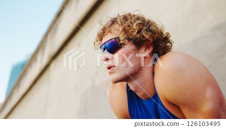 Thinking, breathing and runner or man with glasses in city for workout, marathon training and resting. Reflection, exercise and wellness with male person downtown for cardio, athlete and health 126103495