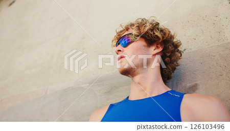 Thinking, wall and runner or man with glasses in city for workout, marathon training and resting. Reflection, exercise and wellness with male person downtown for fitness cardio, athlete and space Thinking, wall and runner or man with glasses in city for workout, marathon training and resting. Reflection, exercise and wellness with male person downtown for fitness cardio, athlete and space 126103496