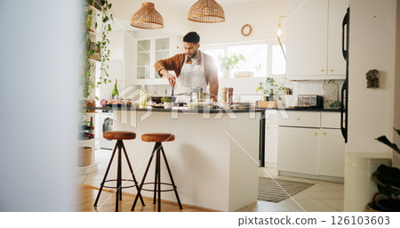 Home, cook and man in kitchen for cooking, culinary skills and ingredients on counter for dinner. House, male person and chef with experience for food recipe, breakfast and meal prep on gas stove 126103603