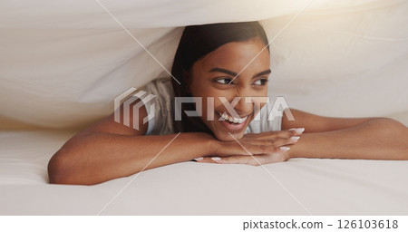 Sheet, laugh and woman in bed with smile, happiness or thinking of funny memory with thoughts. Under blanket, cover or person in bedroom with comfort for dream, relax or morning rest on break in home Sheet, laugh and woman in bed with smile, happiness or thinking of funny memory with thoughts. Under blanket, cover or person in bedroom with comfort for dream, relax or morning rest on break in home 126103618