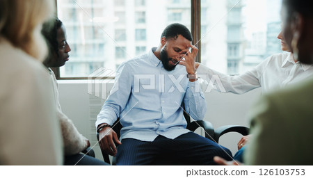 Sad man, meeting and support group with team at office for rehabilitation, empathy or care. Male person, employee or emotional with community for understanding, sympathy or safe space at workplace 126103753