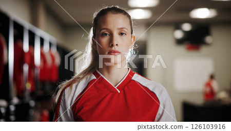 Locker room, girl or soccer player in portrait for sports, match competition or tournament. Serious, development or woman in changing area ready for football game, challenge or playing in contest 126103916