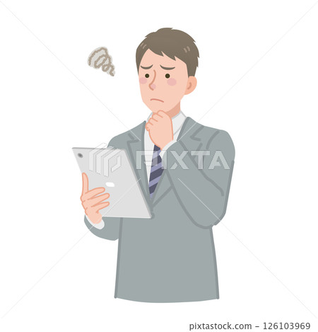 A worried businessman looking at a tablet A worried businessman looking at a tablet 126103969