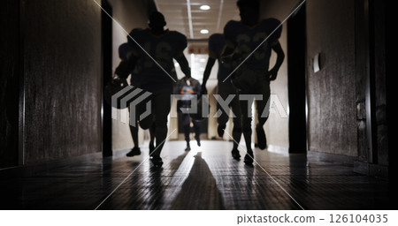 Light, football and running and team in corridor for sports competition, stadium match and game. Fitness, pro league player and athlete with people in tunnel for training, tournament and contest 126104035